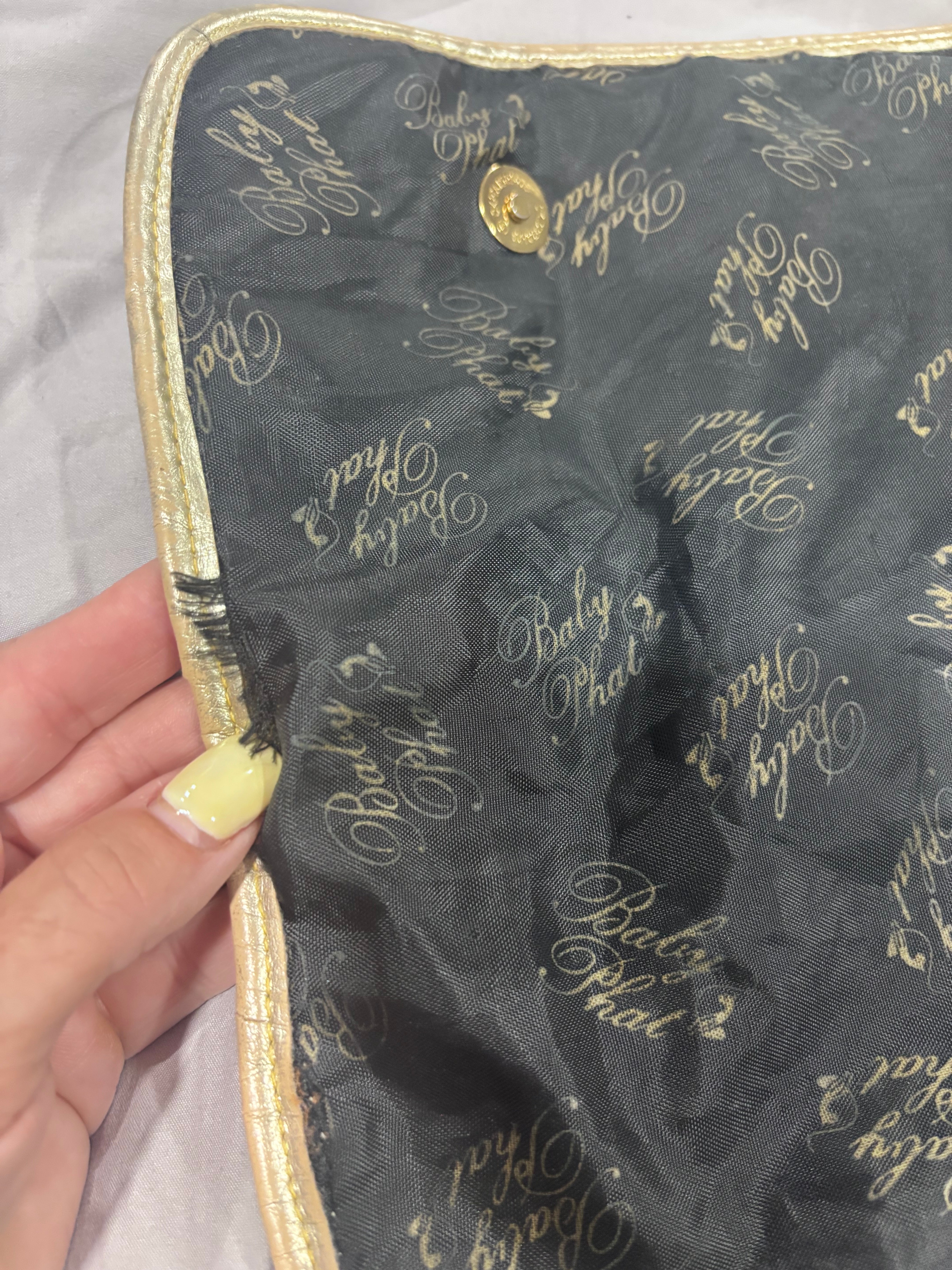 Gently used Baby Phat diaper bag, black and gold