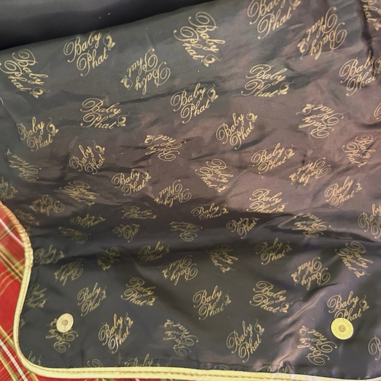 Gently used Baby Phat diaper bag, black and gold