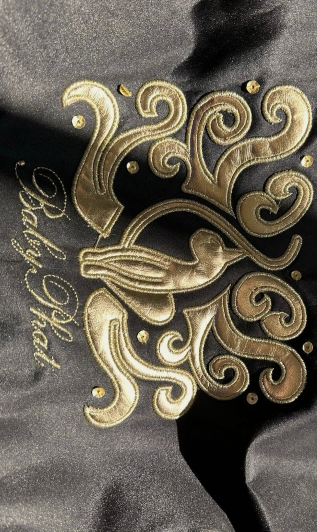 Gently used Baby Phat diaper bag, black and gold