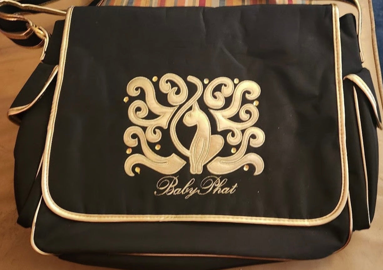 Gently used Baby Phat diaper bag, black and gold